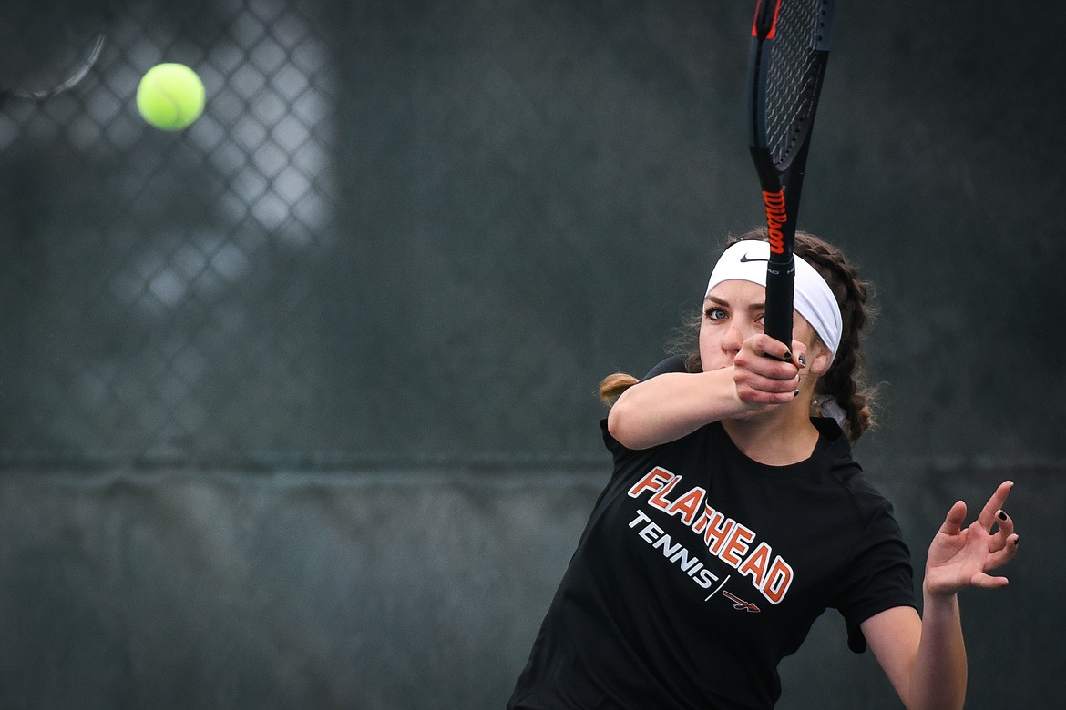 Flathead's Emma Hawkins hits a return in a singles consolation match against teammate Alexis Kersten during the Northern AA Divisional Tennis Tournament at Flathead Valley Community College on Friday. (Casey Kreider/Daily Inter Lake)