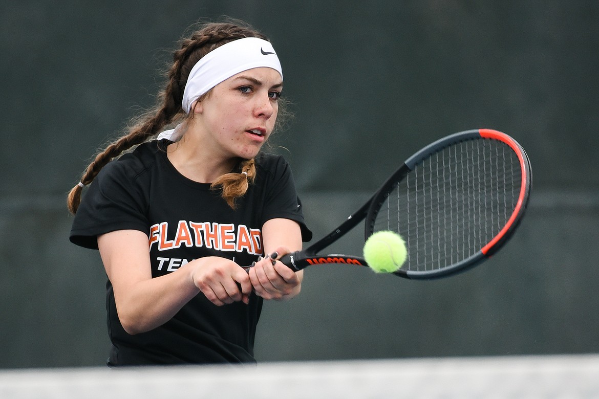 Flathead's Emma Hawkins hits a return in a singles consolation match against teammate Alexis Kersten during the Northern AA Divisional Tennis Tournament at Flathead Valley Community College on Friday. (Casey Kreider/Daily Inter Lake)