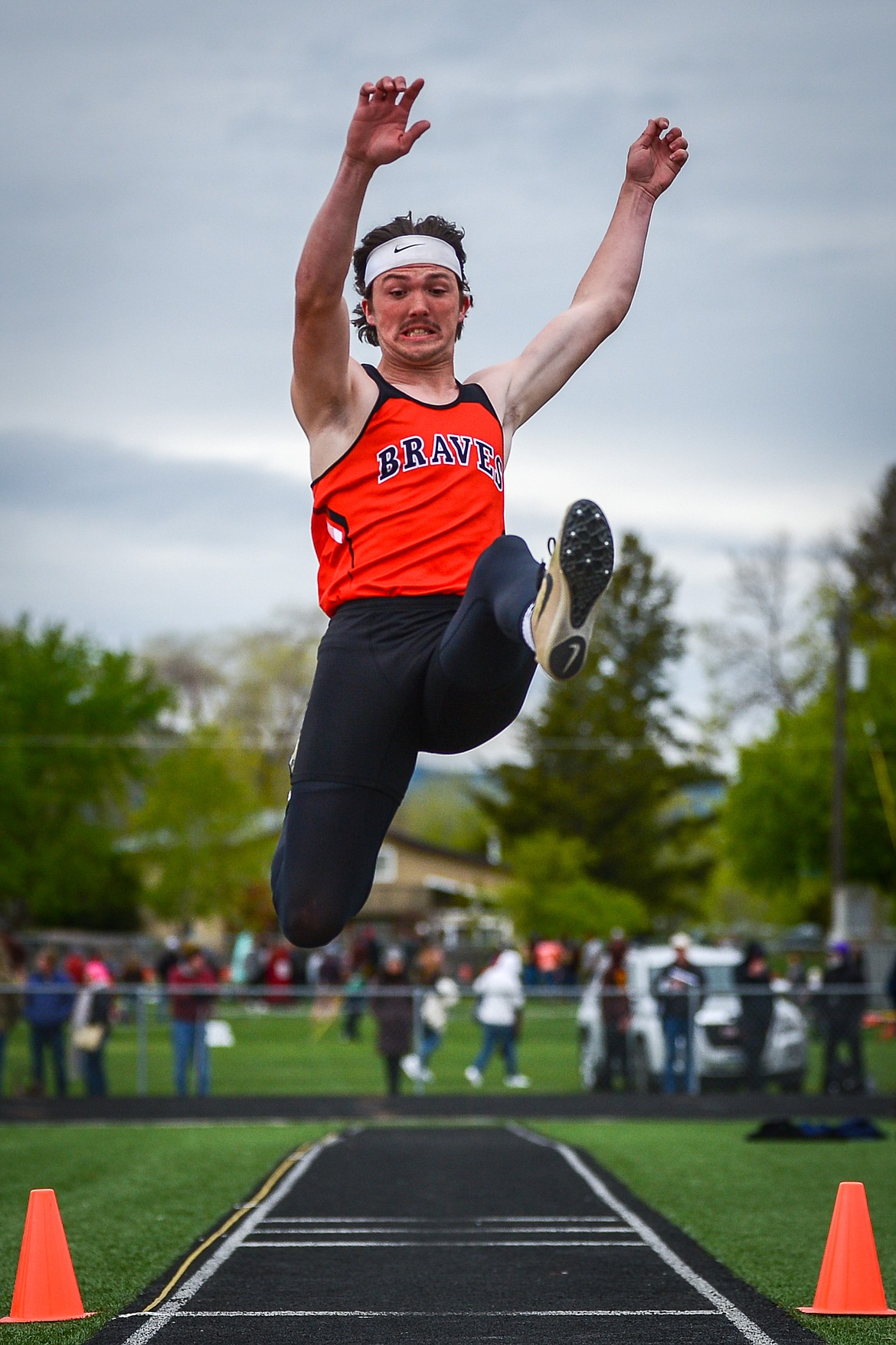 Flathead's Nic Gustafson competes in the long jump during the Western AA Divisional Track Meet at Legends Stadium on Friday. (Casey Kreider/Daily Inter Lake)