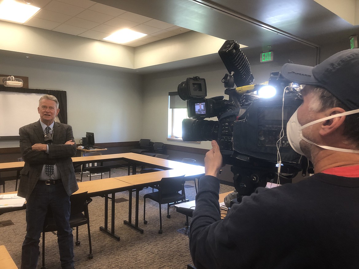 KREM-2 News photojournalist Dave Sommers prepares for Gov. Brad Little’s press conference Friday at the Idaho Department of Labor building in Post Falls.
MIKE PATRICK/Press