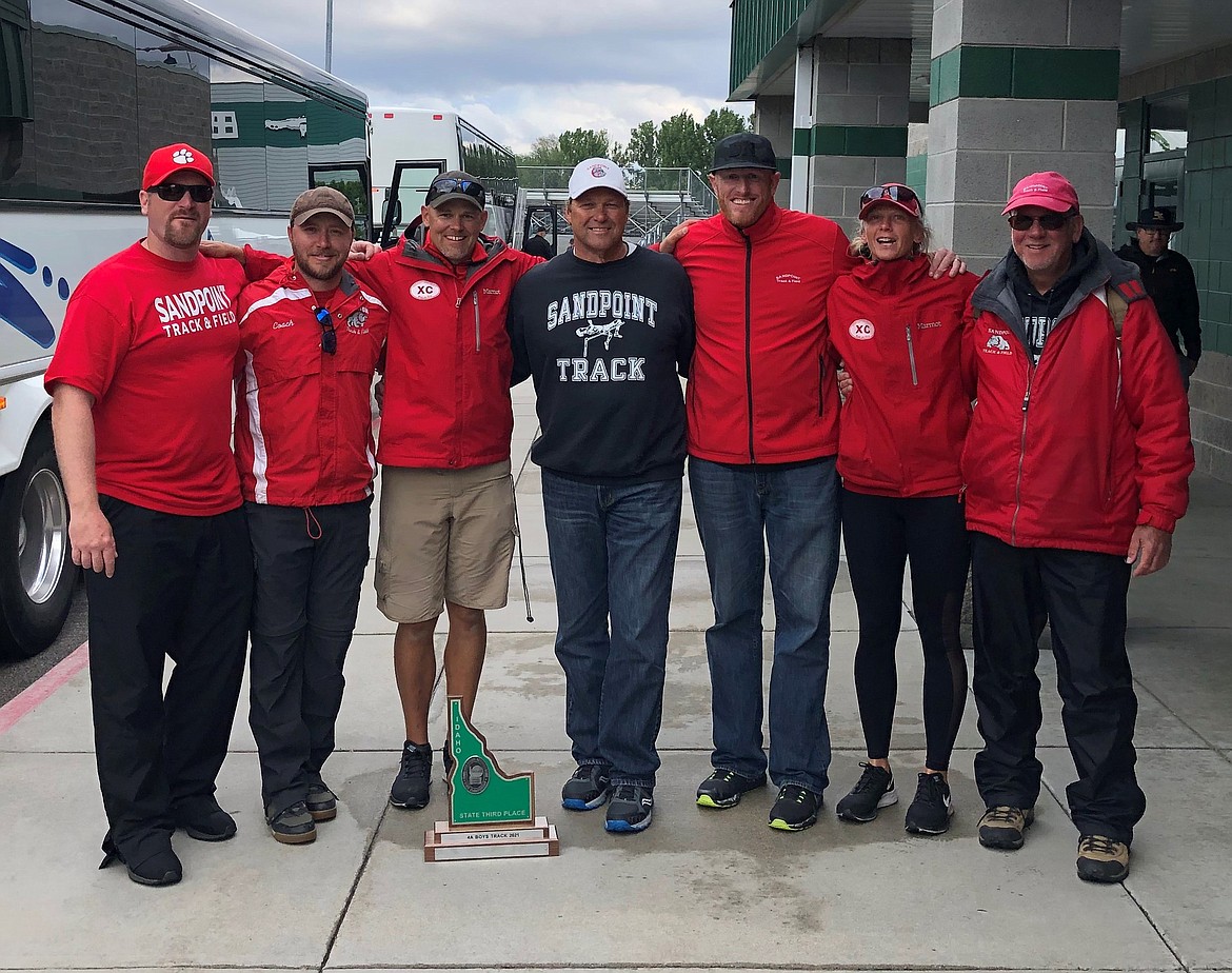 The Sandpoint track coaches pose for a photo with the third place trophy on Saturday.