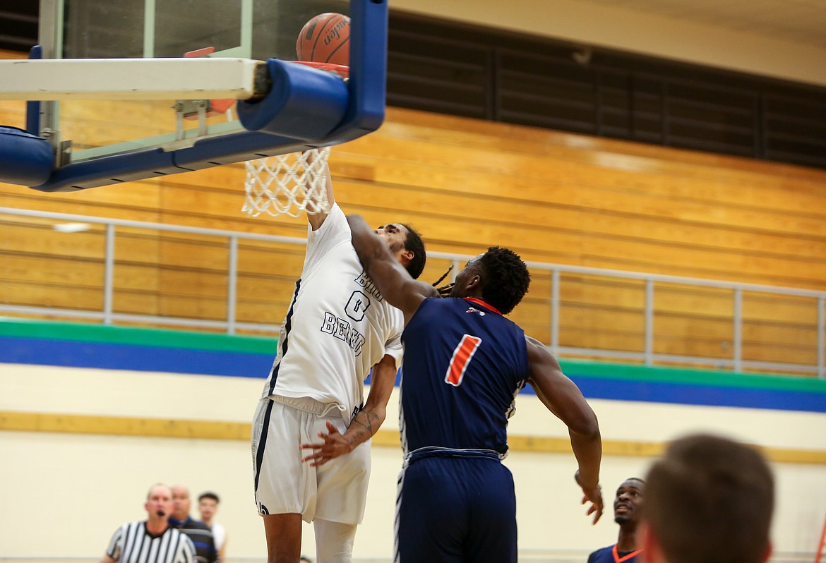 Big Bend freshman Keenan Miller (0) gets the dunk and the foul in the second half of the 100-77 win over Treasure Valley Community College on Saturday.