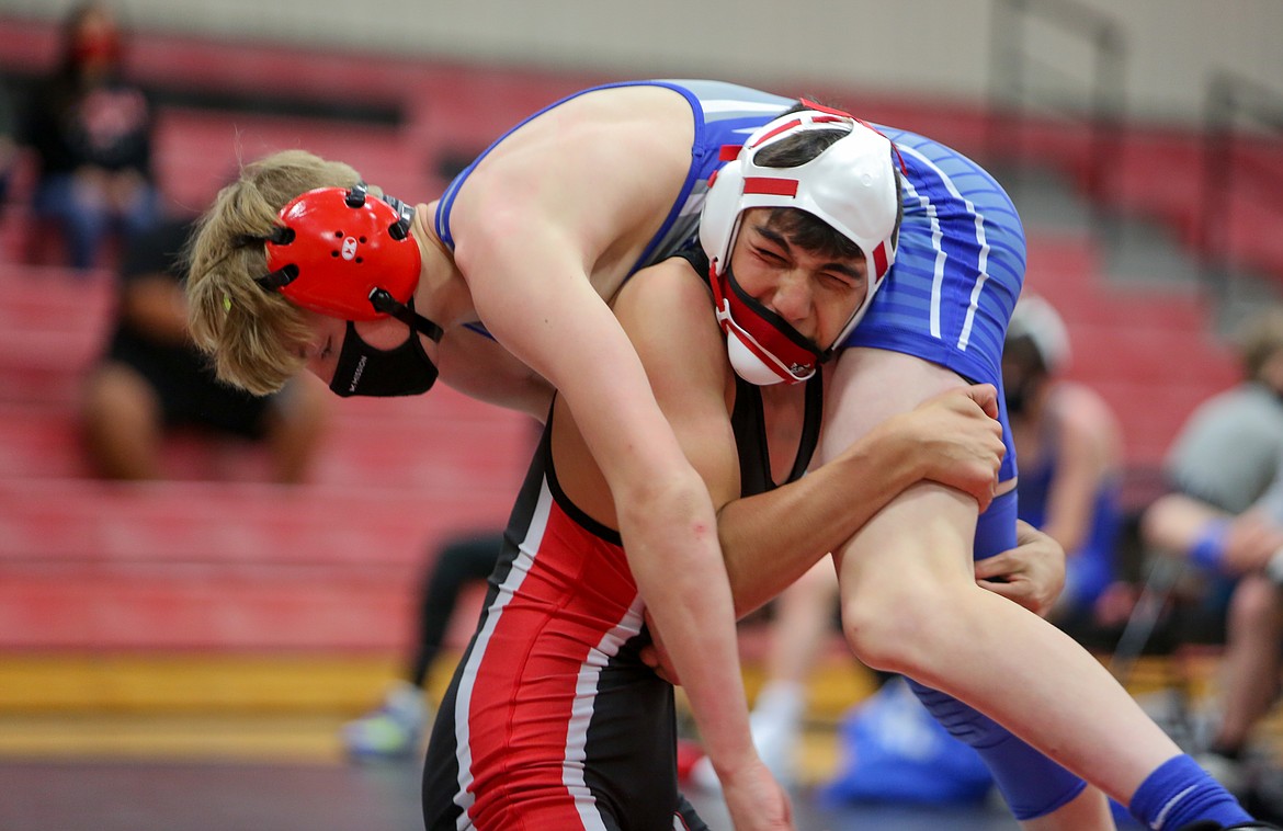 Othello's Isaac Campos holds his opponent before taking him back down to the mat in the home opener for the Huskies boys wrestling team last Thursday at Othello High School.