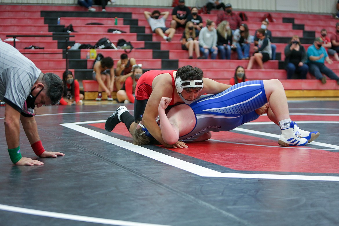 Othello High School’s Anthony Trujillo relaxes the moment after picking up the win against Pullman’s Holden Chandler at 220 last Thursday evening in the second match of the double dual.