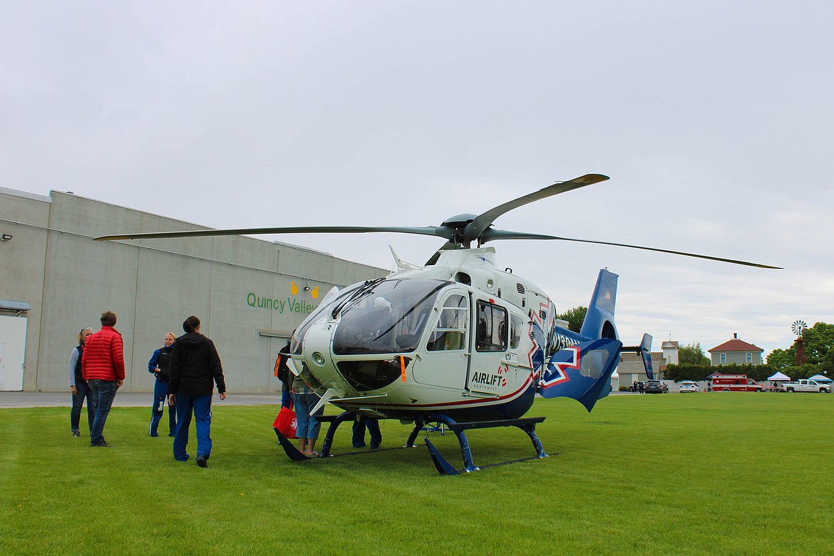 An Airlift Northwest helicopter stands outside the Quincy Valley Historical Society & Museum.