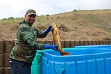 Carp for a cause: Bowfishing tournament cleans lake