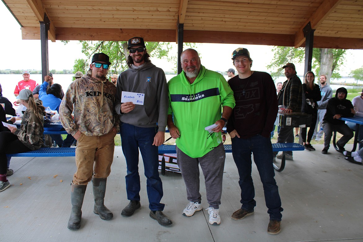 Left to right: Trevor Gibson, Gavin Wing, Ty Swartout and Colby Myers claim their wins of most carp and heaviest 10 at the Moses Lake Carp Class Tournament on Saturday.