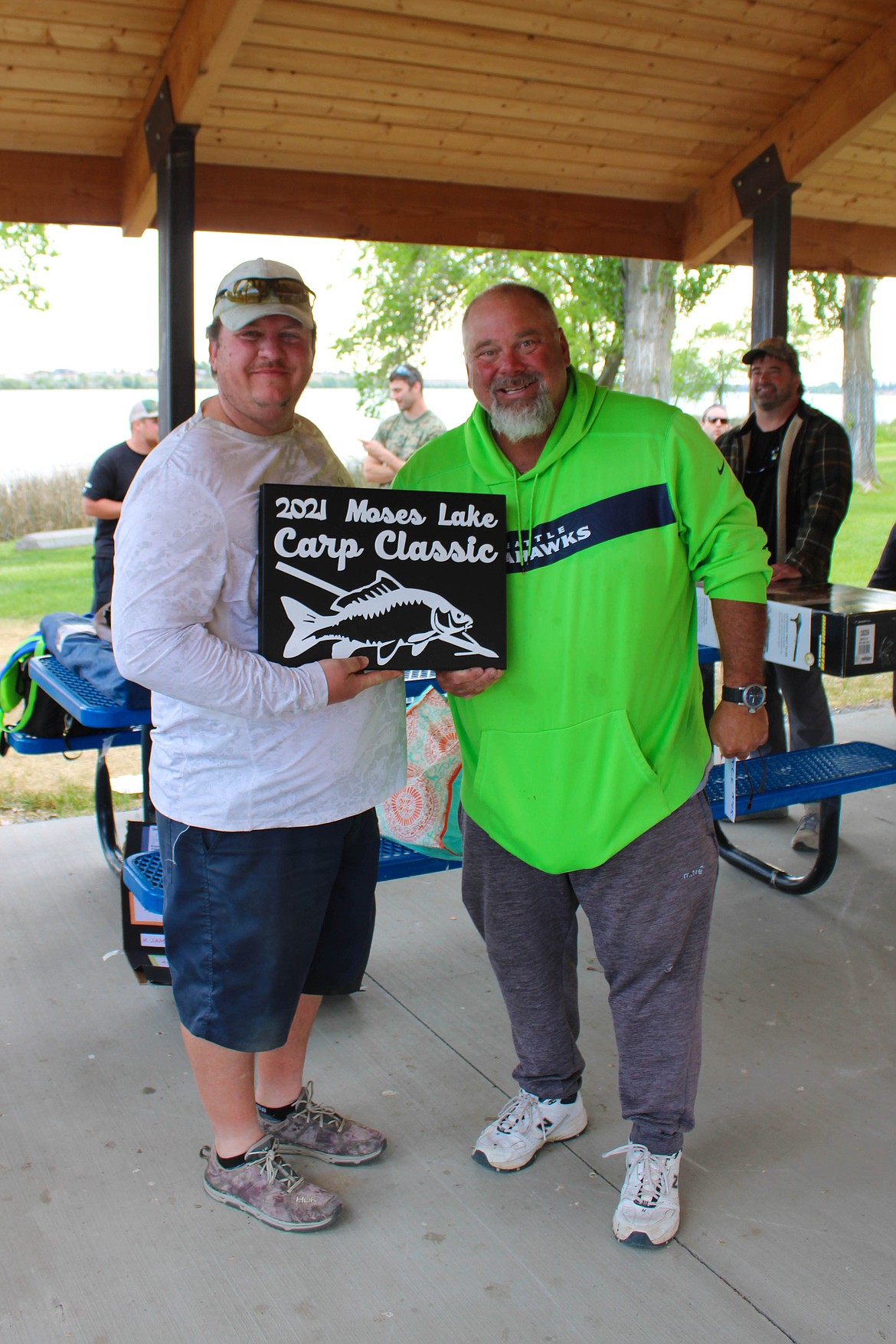 Ephrata resident Marc Noel claims his plaque for the largest carp at the Moses Lake Carp Class Tournament on Saturday.