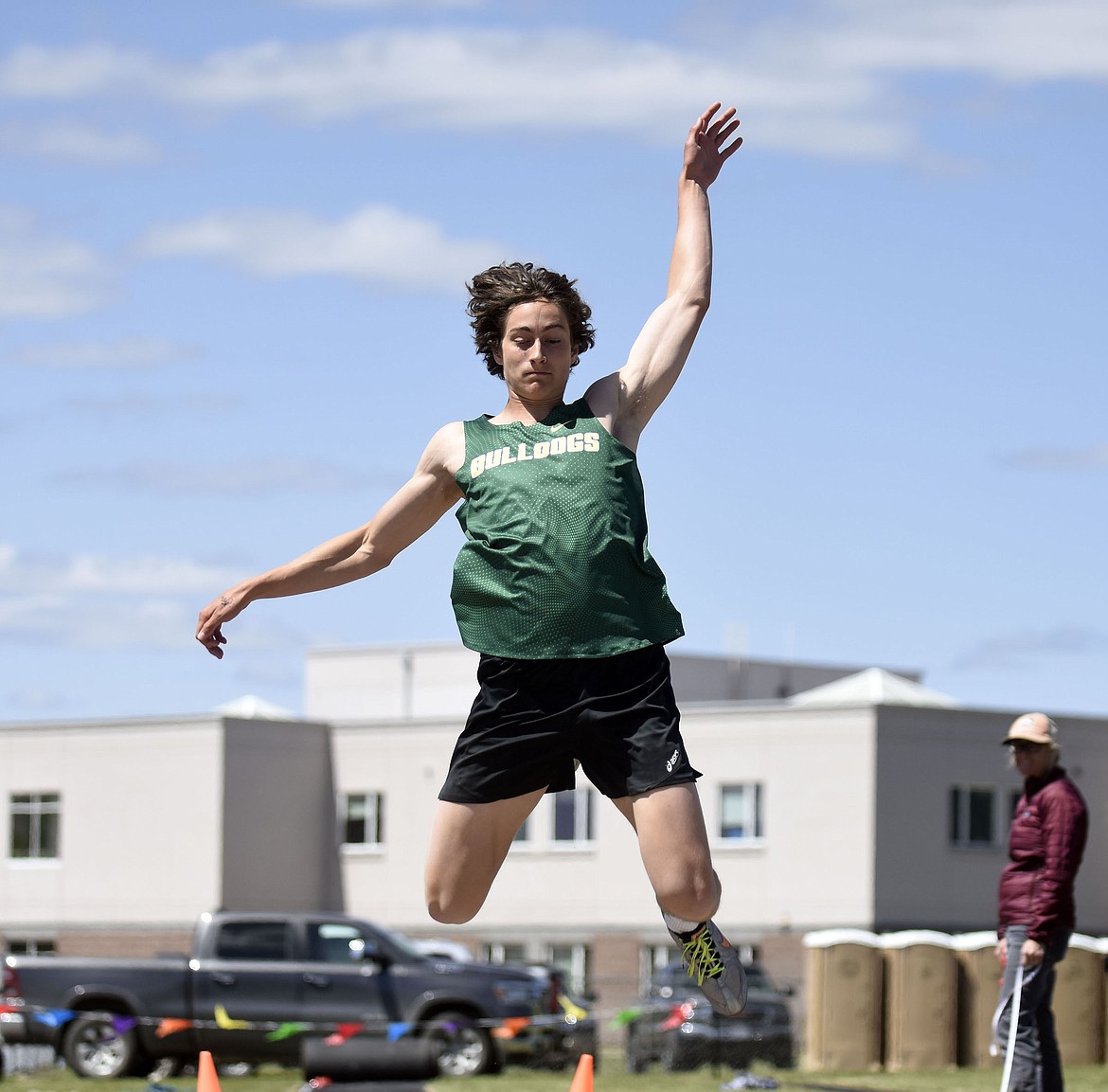 Gabe Menicke competes in the triple jump, taking first in the event at the Western A divisional track meet in Columbia Falls on Saturday. (Teresa Byrd/Hungry Horse News)