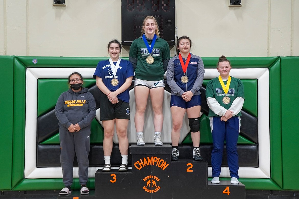 Big Bend's Avery Ackerman stands atop the podium at the Women's Junior College National Championship on Friday, May 14, after taking first in the 170 weight class.