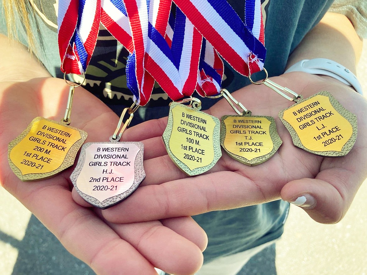 Sydney Brander of Mission displays her five medals from the Western B divisional meet. (Courtesy of Daisy Adams)