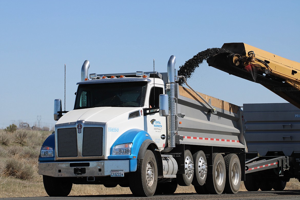 Central Washington Asphalt Inc. employees plane the Interstate 90 roadway east of George before paving it with hot mix asphalt.