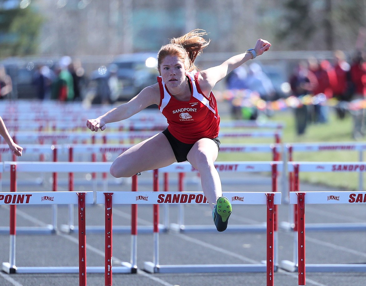 Taylor Petz competes in the 100 hurdles at the Sandpoint Inland Empire League meet on April 13. The senior took sixth in the event at state and placed second in the pole vault.