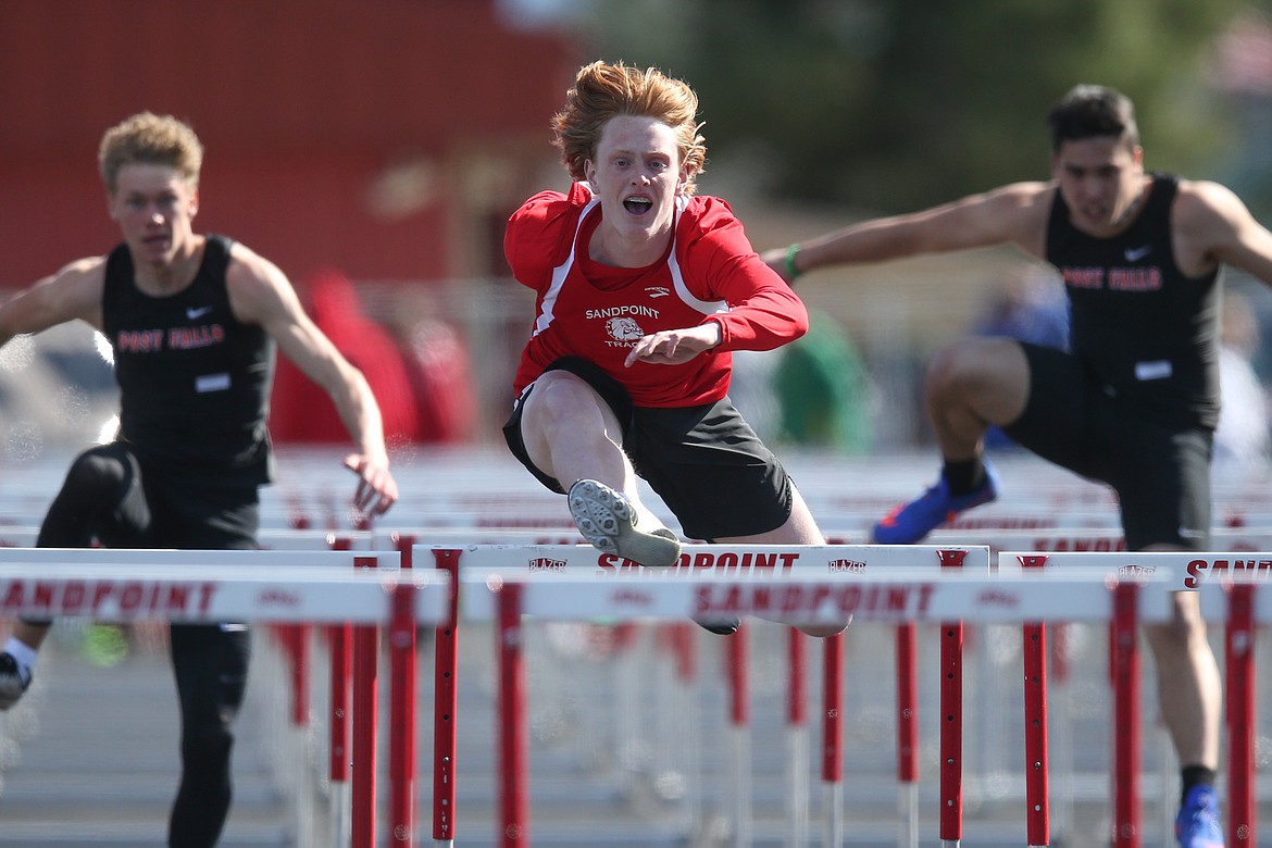 Rusty Lee competes in the 110 hurdles at the Sandpoint Inland Empire League meet on April 13. Lee broke the school record in the 300 hurdles on Saturday at the 4A state track meet and placed second. He also claimed three other state medals.