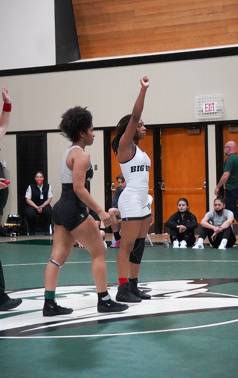 Big Bend Community College's Aliyah Yates holds her hand high after winning a bout at the Women's Junior College National Championship on Friday, May 14.