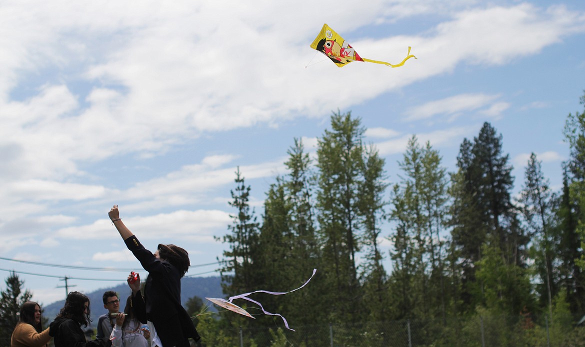 Eoin Eddy runs with his kite Friday at Sandpoint High School.
