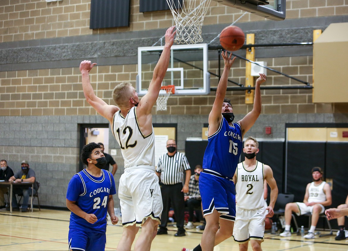 Warden High School's Oziel Martinez goes up for a layup in the second half on Monday night against Royal High School in Royal City.