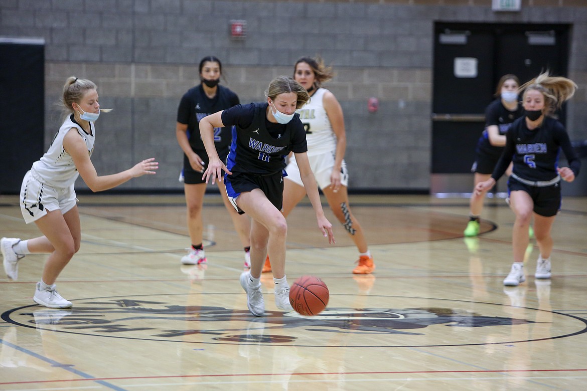 Warden High School freshman Lauryn Madsen takes off on a fast break after a steal against Royal High School on Monday night in Royal City.