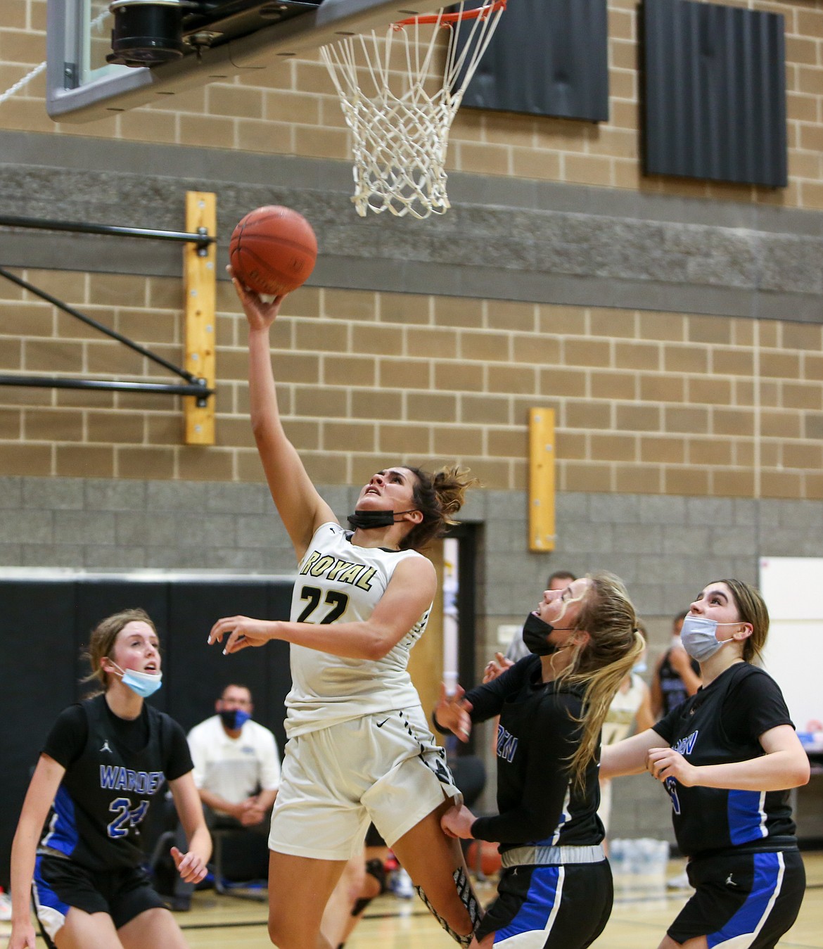 Royal High School's Chenoa Louie goes up for a layup in the paint against Warden High School on Monday evening at the Royal Intermediate School gym.