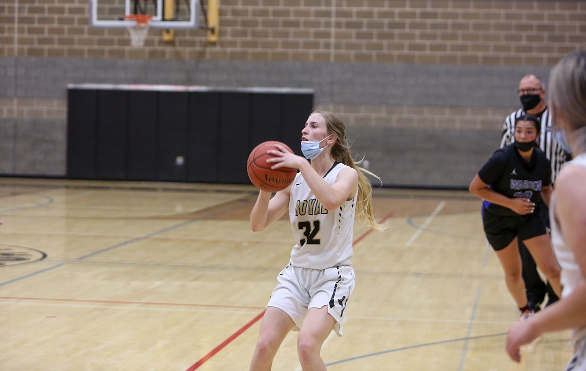 Royal's Raylie Wardenaar fires a three for the Knights in the first half on Monday evening in the matchup with Warden High School.