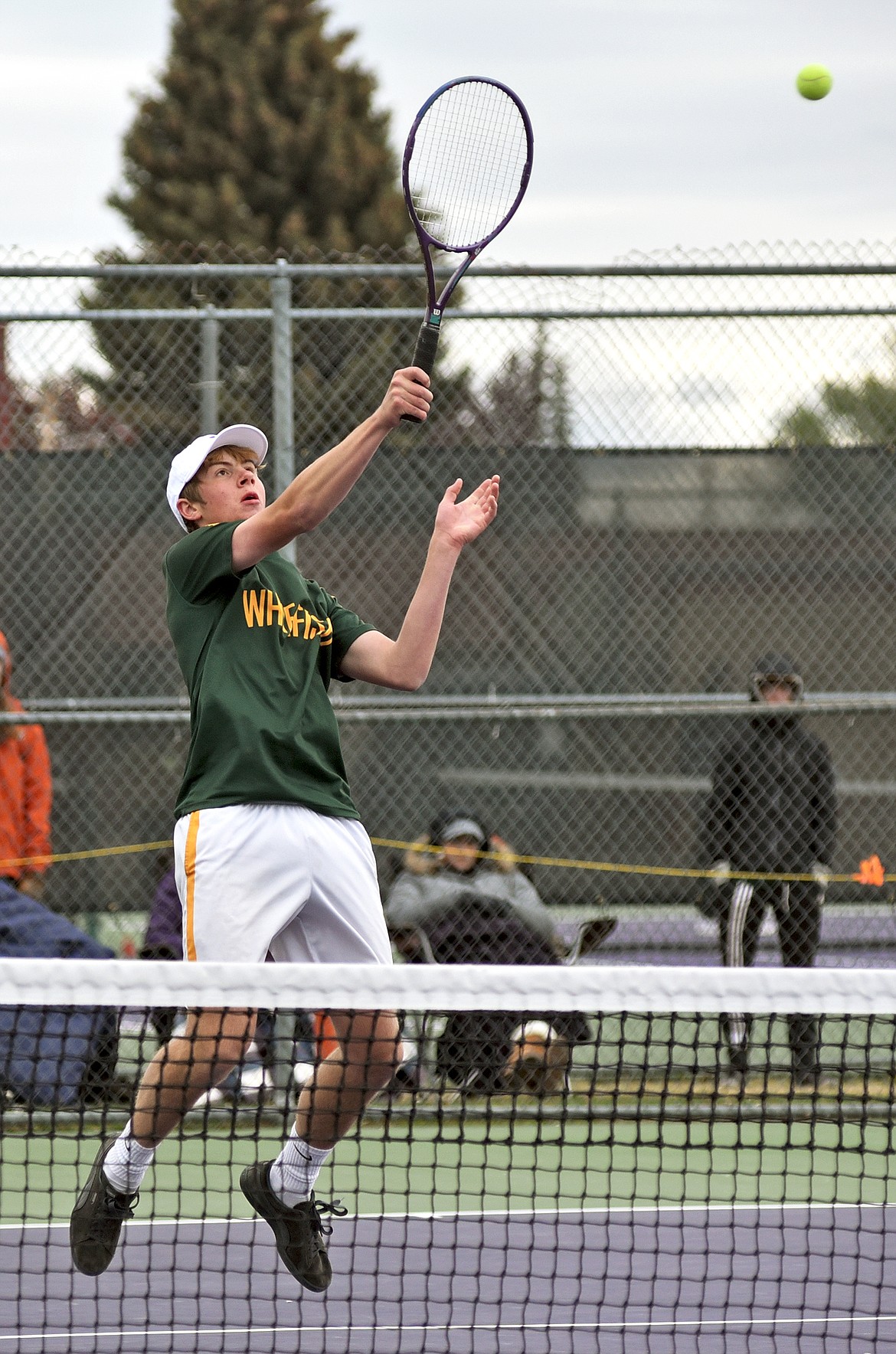 Bulldog Aaron Dicks plays in a doubles match against Polson at the Northwestern A Tennis Divisional Tournament in Polson on Friday. (Whitney England/Whitefish Pilot)