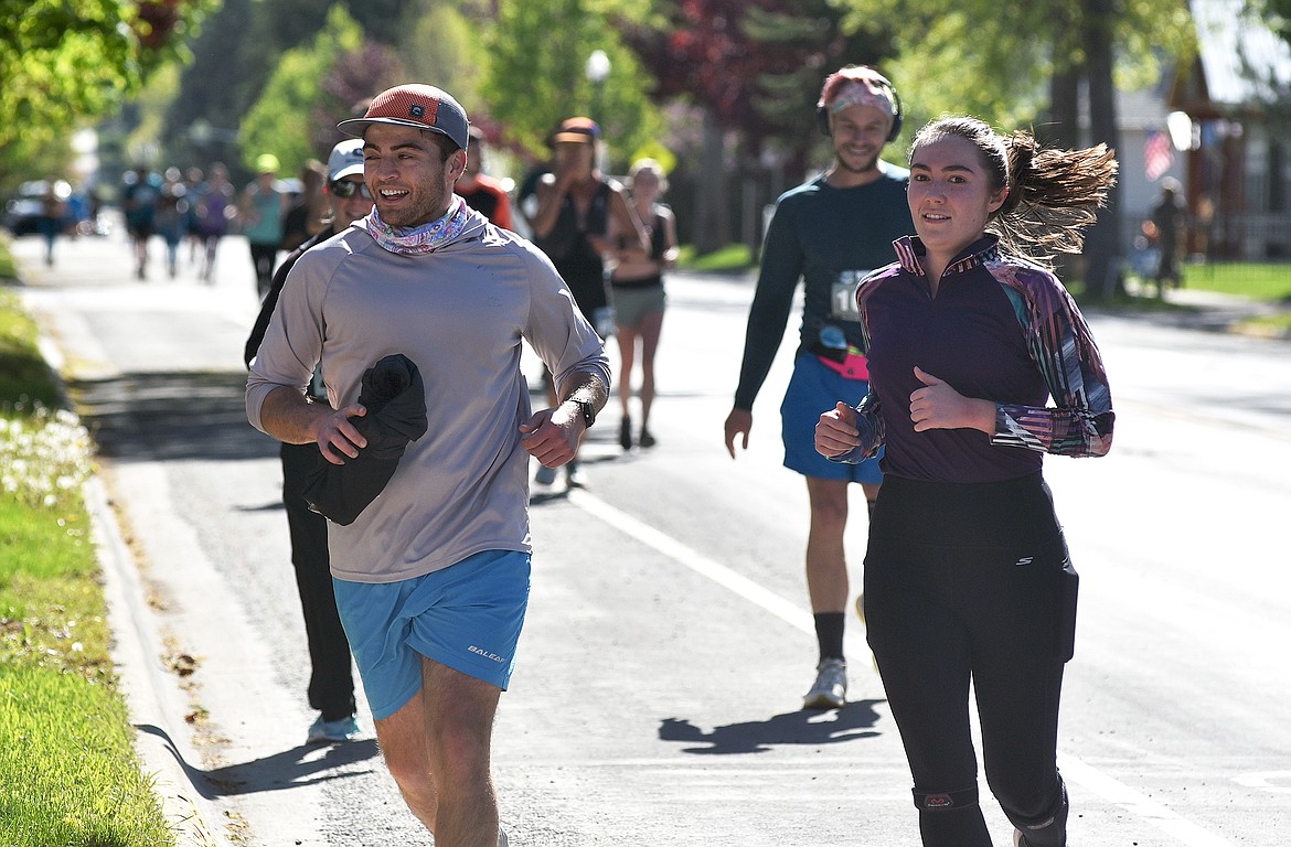 Runners make their way down Second Street during the Whitefish Marathon on Saturday. (Whitney England/Whitefish Pilot)