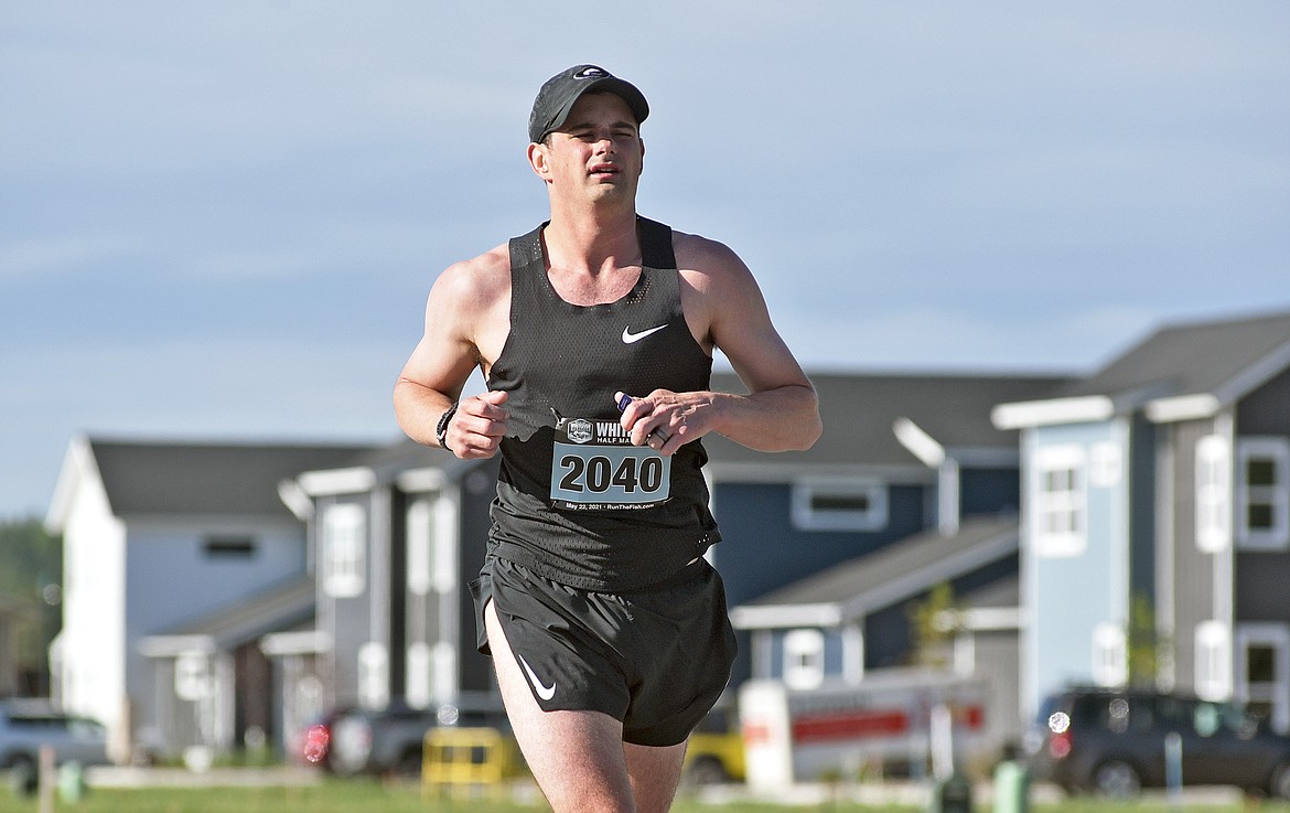 Wade Voyles of Kalispell runs near the Trailview subdivision in Whitefish during the Whitefish Marathon on Saturday. He took second overall in the half marathon race. (Whitney England/Whitefish Pilot)