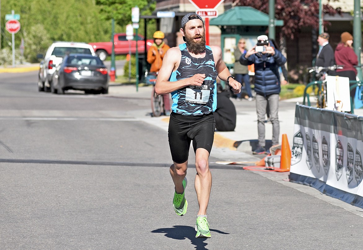 Micah Drew of Kalispell nears the finish line as he runs to first place in the Whitefish half marathon race on Saturday. (Whitney England/Whitefish Pilot)
