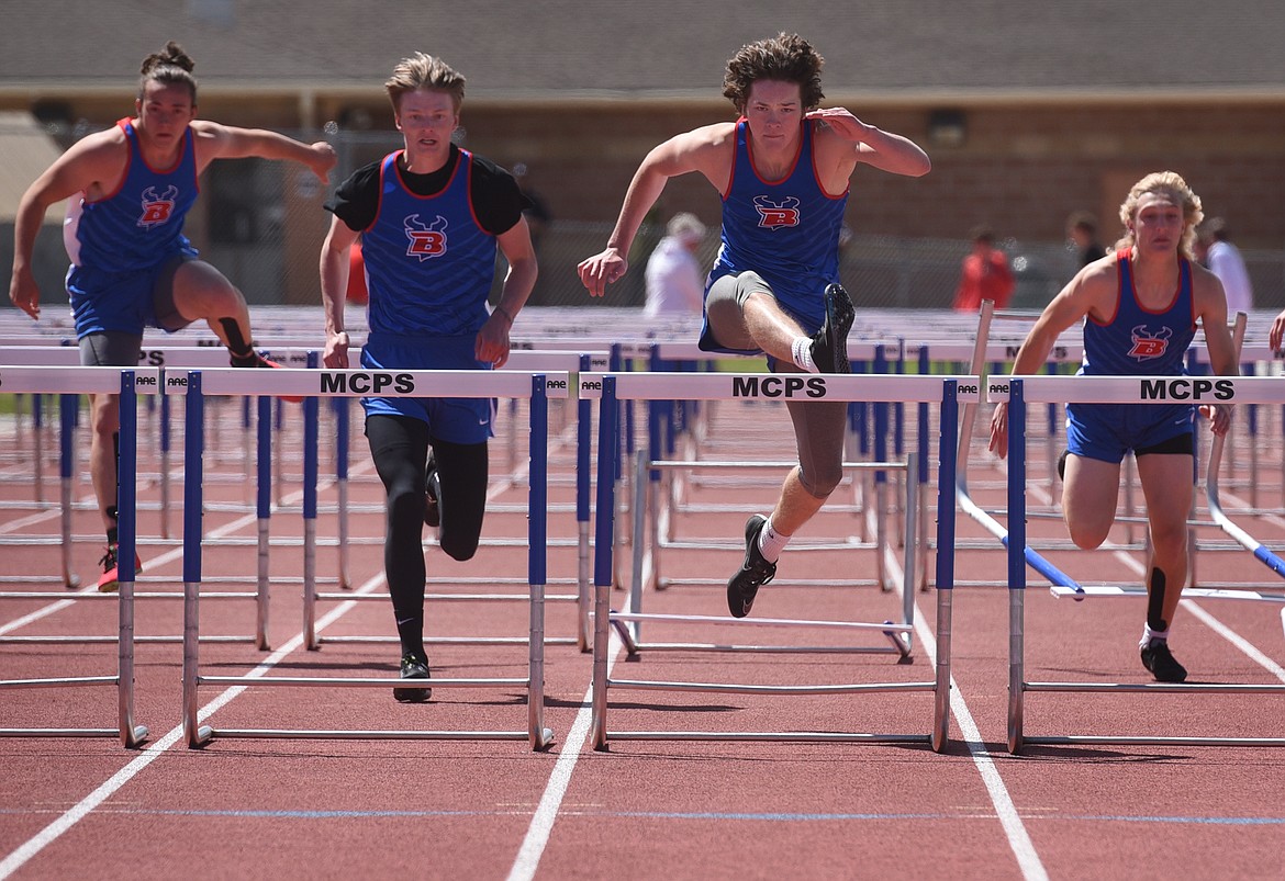 Isak Epperly clears the final hurdle on his way to winning the 110 hurdles at the Western B Divisional Meet in Missoula Saturday. Wyatt Duke (left) was third, Jordan Betts (far left) was third and Wyatt Johnson (right) took fifth.
Jeremy Weber/Bigfork Eagle