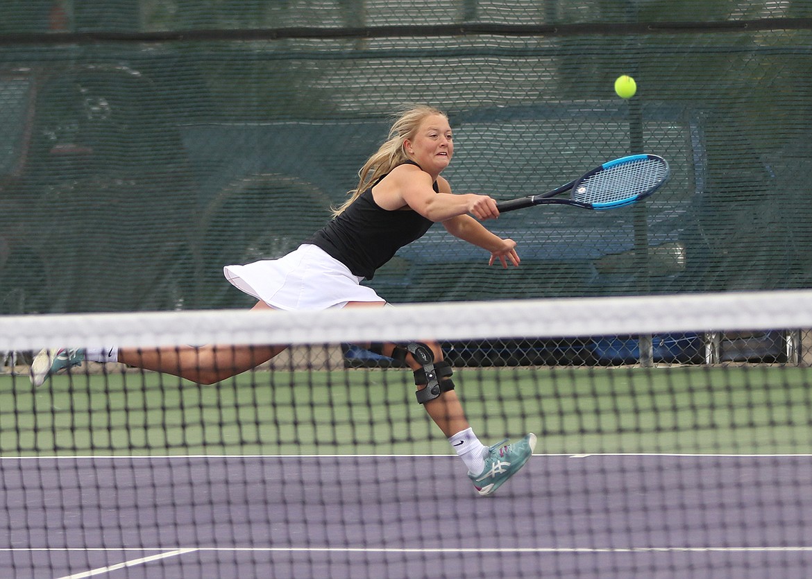 Polson's Claire Todd hits a shot during a doubles match at the Class A divisional tournament in Polson. (Courtesy of Bob Gunderson)