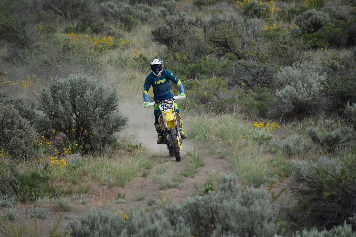 Alex Harvill rides across the Soap Lake Sandpits as he gets ready to demonstrate a few practice jumps.