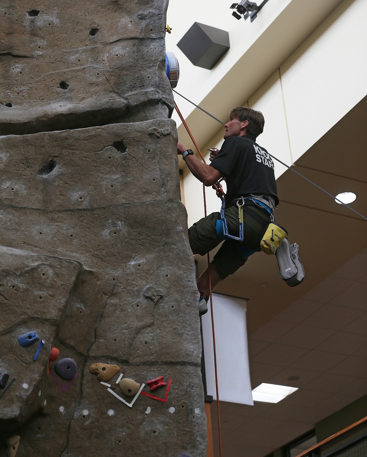 Kroc Center employee Dan Shaw conducts maintenance on the climbing wall on May 13. The Kroc celebrated its 12th anniversary on May 11 and continues to expand membership and programming as life returns to normal.