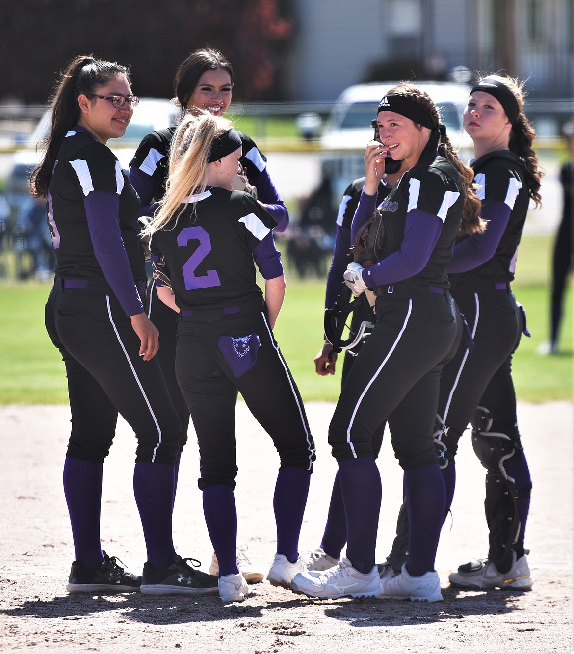 Junior pitcher Katelyne Druyvestein (2) meets at the mound with Polson's five seniors prior to the Libby game. From left: Mossy Kauley, Josie Caye, Druyvestein, SaVanna Carpentier (background), Kobbey Smith and Lexy Orien. (Scot Heisel/Lake County Leader)