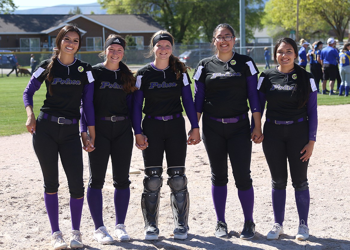 Polson seniors, from left, Josie Caye, Kobbey Smith, Lexy Orien, Mossy Kauley and SaVanna Carpentier round the bases together prior to their regular season finale Saturday against Libby. (Courtesy of Bob Gunderson)