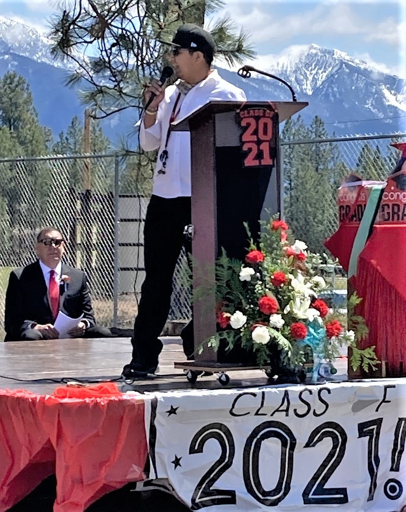 Featured speaker DJ Piapot, Salish teacher, coach, and Two Eagle River alum, challenged 2021 graduates to see the world and other cultures, learn something new every day and "Be tough on yourselves, but during tough times, be gentle on your heart." (Carolyn Hidy/Lake County Leader)