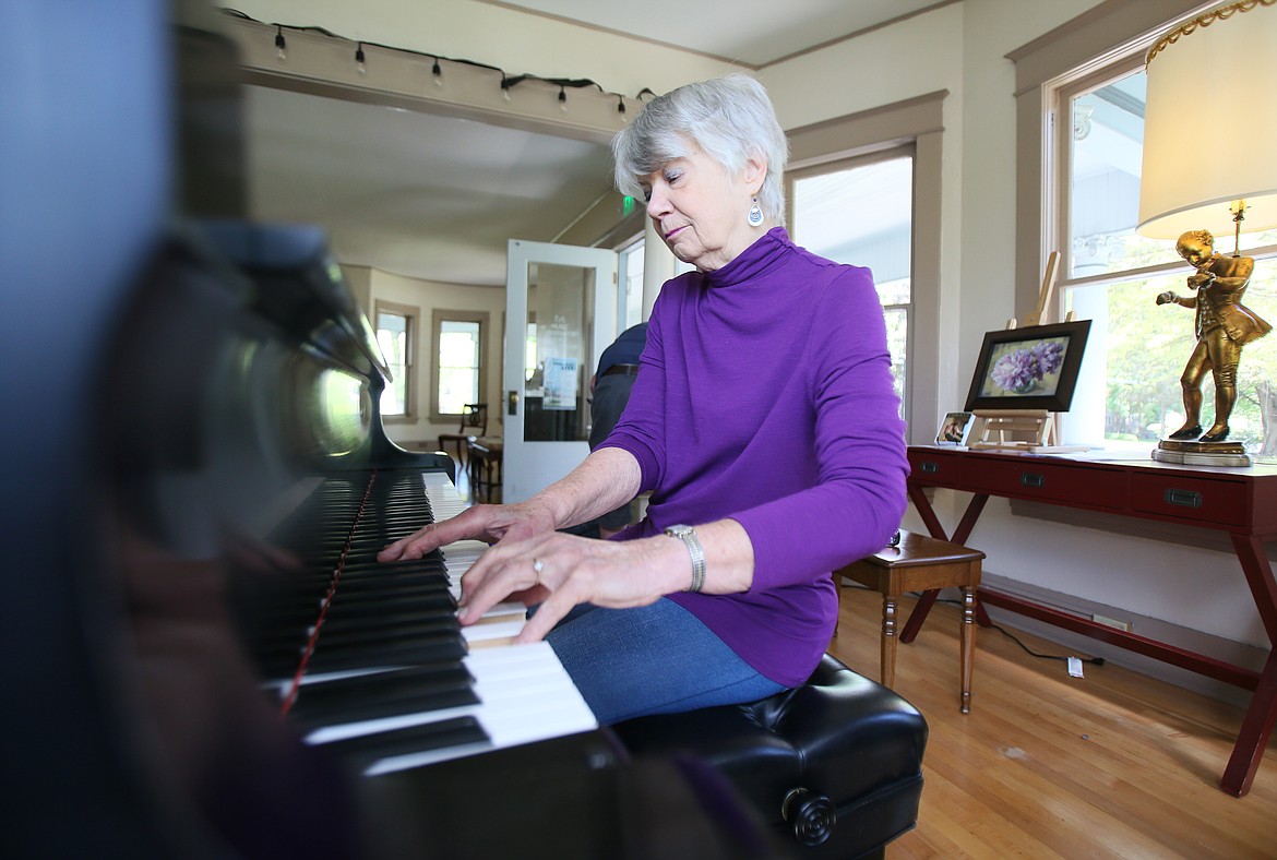 Joanne Smith of Coeur d'Alene plays a little tune on the Yamaha grand piano she donated to the Music Conservatory of Coeur d'Alene on Wednesday.