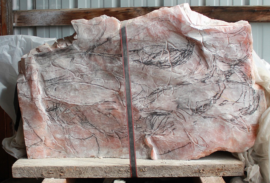 Raw stone waiting to be carved into salmon in motion (Photo by Rose Shababy)
