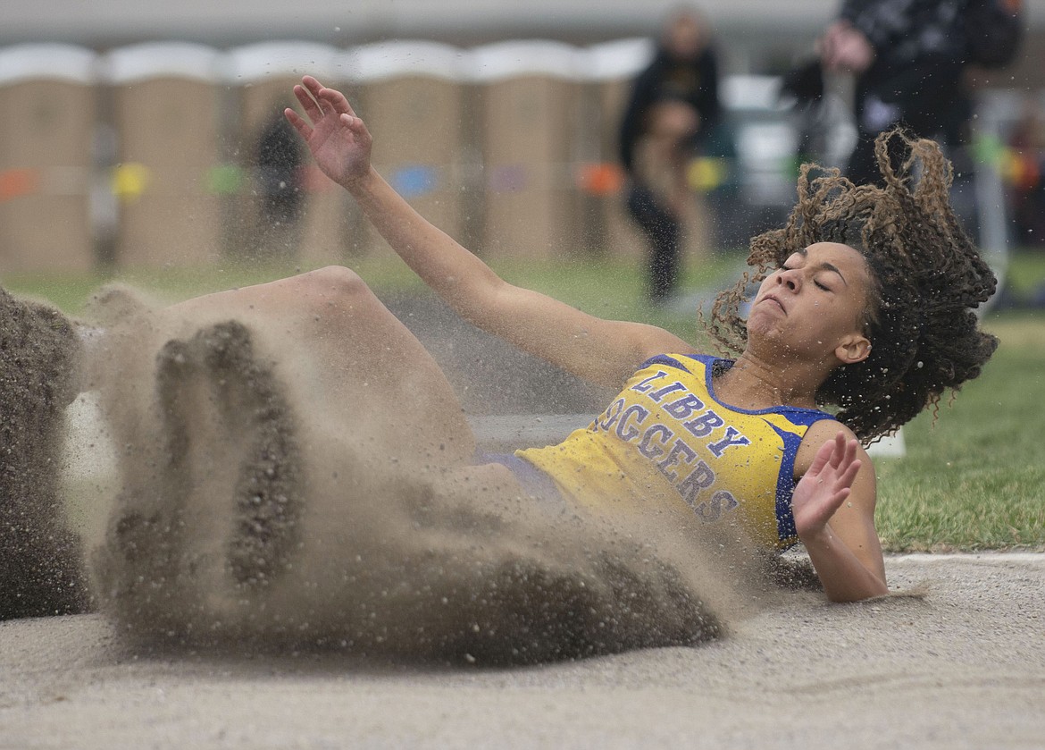 Olivia Gilliam-Smith lands a long jump at the Western A divisional track meet in Columbia Falls on Friday. (Teresa Byrd/Hungry Horse News)(Teresa Byrd/Hungry Horse News)