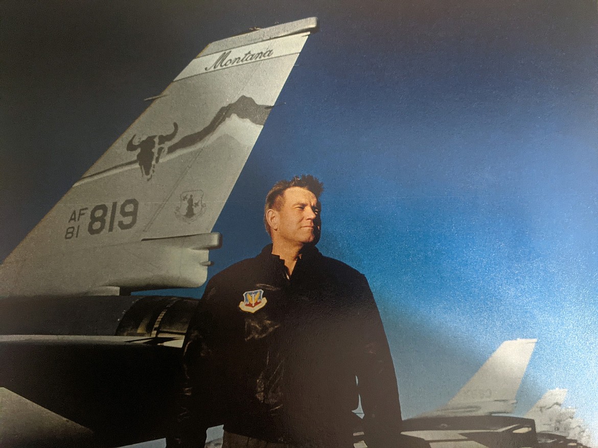Jim Higgins, veteran and director of the Veterans Coalition of Northwest Montana, stands in front of an F16 at Great Falls International Airport in 1993. (Courtesy of Jim Higgins)