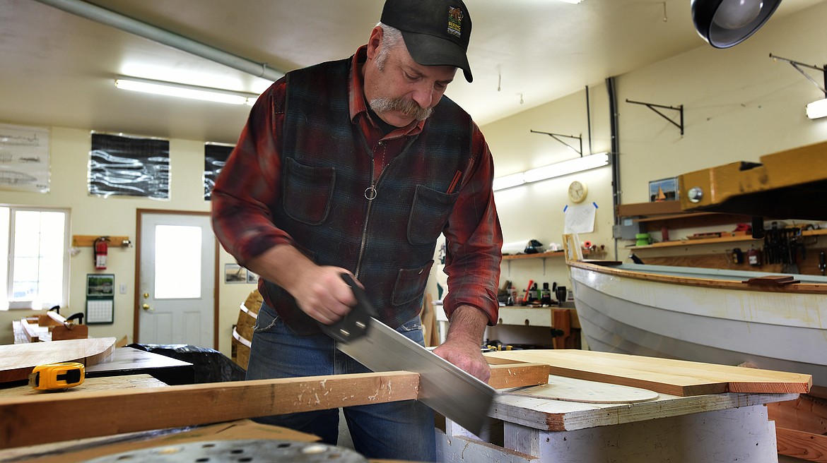 Colin Milone, whose family is building a Norwegian-style sailboat, cuts lengths of board for the project on Wednesday, May 26, 2021, at the Montanan Wooden Boat Foundation in Lakeside. (Jeremy Weber/Daily Inter Lake)