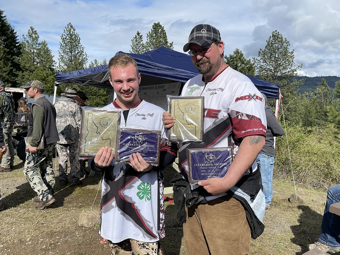 Nic Peacock and coach Jason Ham accept the Idaho State marked 3-D first place awards in their classes, as well as first place for the Clearwater Archers shoot at Freeman Creek, Dworshak State Park.