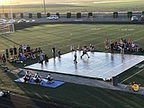 Wrestlers take to the mat outdoors in Royal triple dual