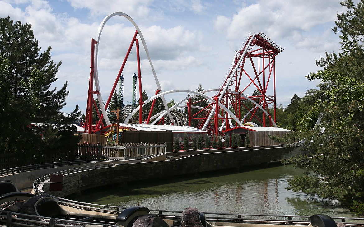 Silverwood Theme Park's newest roller coaster, Stunt Pilot, is seen here above the Roaring Creek Log Flume ride on Thursday.