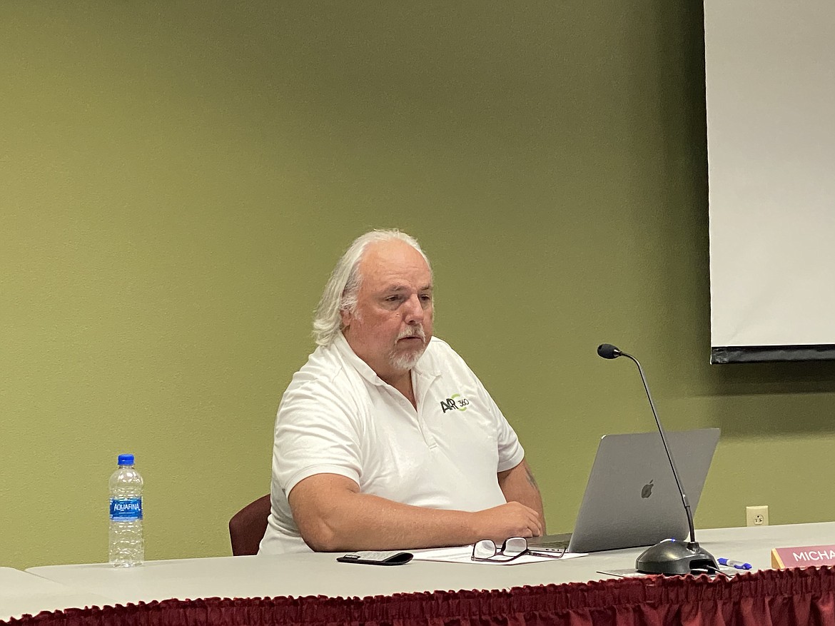 North Idaho College Trustee Michael Barnes read the board's collaborative response to a recent complain that their actions were adversely impacting the institution's credibility. (MADISON HARDY/Press)