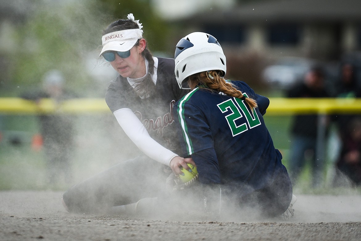 Glacier's Kenadie Goudette (20) slides into second ahead of the tag by Helena second baseman Reegan Walsh (3)  during the State Class AA Softball Tournament at Kidsports Complex on Friday. (Casey Kreider/Daily Inter Lake)