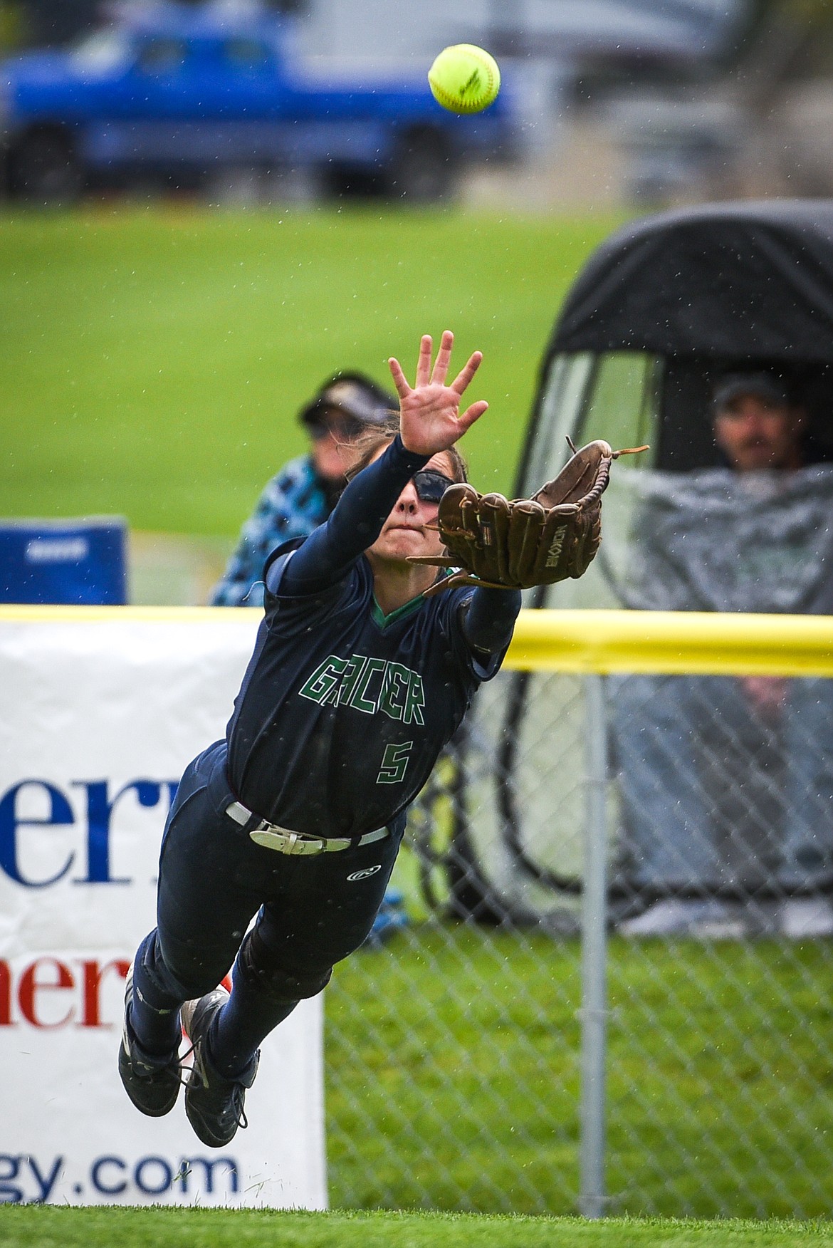 Glacier center fielder Kenna Vanorny (5) makes a diving catch in the outfield against Helena during the State Class AA Softball Tournament at Kidsports Complex on Friday. (Casey Kreider/Daily Inter Lake)