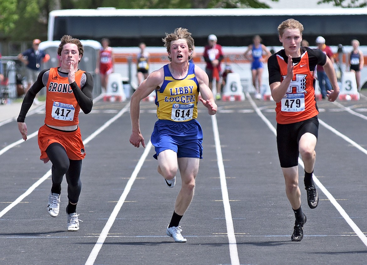 Libby sprinter Jay Beagle runs in the 100 meter dash finals at the Montana Class A-B State Track and Field Meet in Laurel on Saturday. He took fourth in the 100 after becoming the State A champion in the 400 on day one. (Whitney England/Whitefish Pilot)
