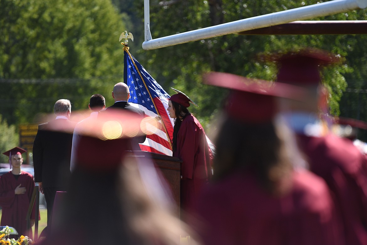 Senior Emma Anderson sings the national anthem at the beginning of the Troy High School commencement ceremony on May 29, 2021. (Derrick Perkins/The Western News)