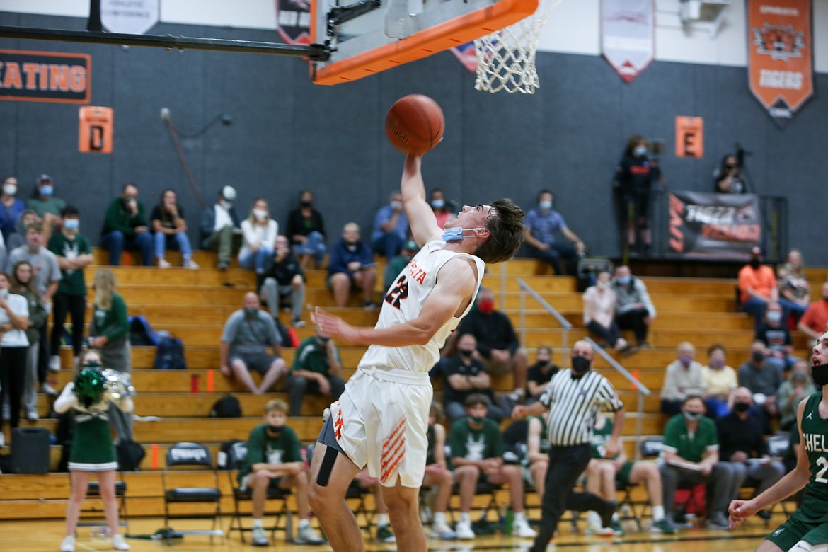 Ephrata guard Jacob Rawley soars in for a layup on a fast break in the first half of the win for the Tigers over Chelan High School at home on Friday night.