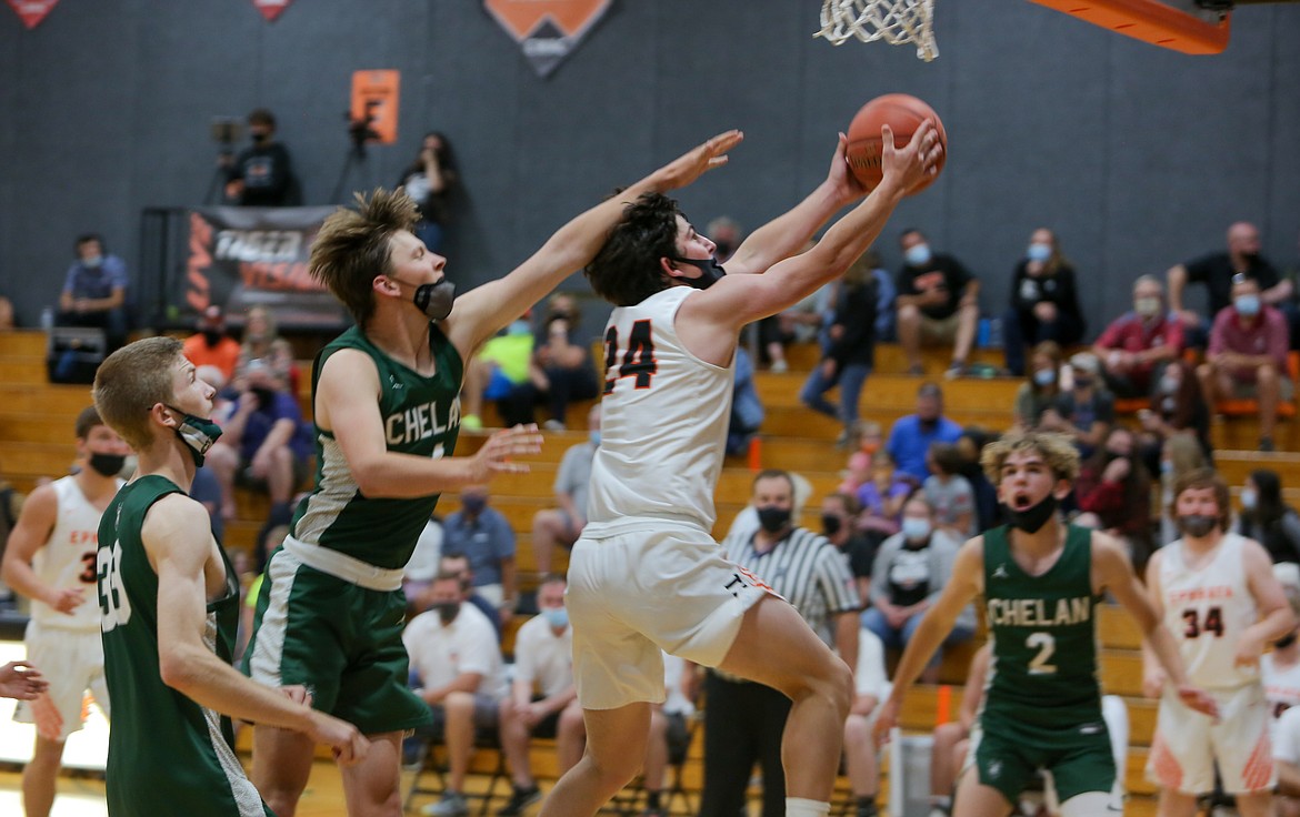 Ephrata's Ethan Black soars in for a layup while taking the contact from the defender in the second half on Friday night at Ephrata High School.